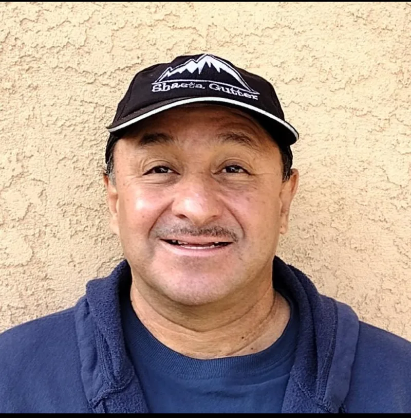 A Shasta Gutter Cleaning and Guards technician